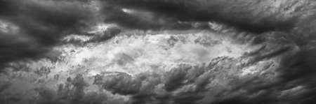 Dramatic gray clouds, sky before the rain. Rain clouds panoramaの写真素材