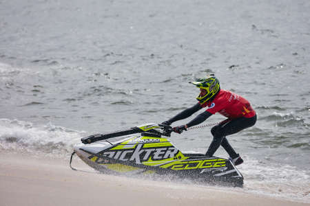 Professional jet ski riders compete at the IFWA World Tour Jet Ski Championship. Contestants perform tricks for judges in the waves. Freeride World Championship IFWA. 04/27/2018, Nazare, Portugalのeditorial素材