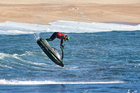 Professional jet ski riders compete at the IFWA World Tour Jet Ski Championship. Contestants perform tricks for judges in the waves. Freeride World Championship IFWA. 04/27/2018, Nazare, Portugalのeditorial素材