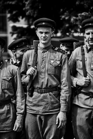 People in military uniform in honor of the Victory Day holiday. Military historical society, reconstruction of the appearance of fighters of the Second World War II. Rostov-on-Don. Russia 09.05.2018のeditorial素材