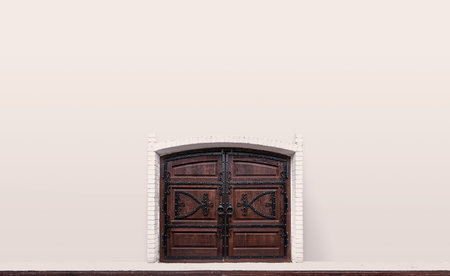 Old wooden gate in a pink wallの写真素材