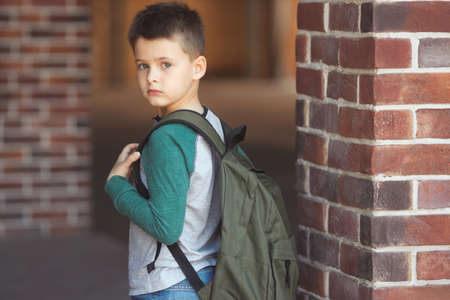 Sad little boy 6-7 years old dont want goes to schoolの写真素材