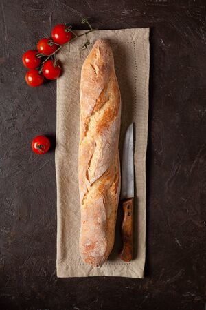 Freshly baked homemade baguette or bread with a crispy crustの写真素材