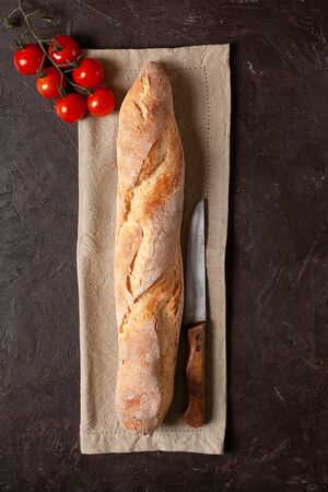 Freshly baked homemade baguette or bread with a crispy crustの写真素材