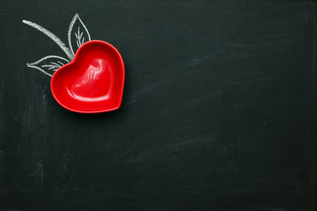 red heart form of Strawberry. Coated chalkboard with copy space wallpaper background. Valentines day congratulate postcard letter.の写真素材
