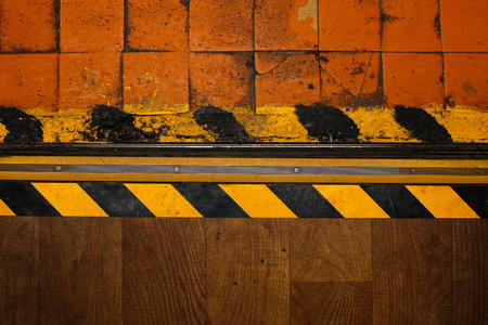 Floor danger zone warning tape yellow with black. Caution - danger. Old vintage wallpaper. Texture...