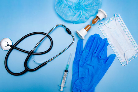 Top view of doctor table with stethoscope and other equipmentの写真素材