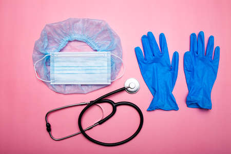 stethoscope, gloves and medical mask, injections on a pink backgroundの写真素材