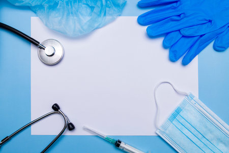 Medical clipboard, stethoscope, rubber gloves, protective mask on a blue background. Medical banner...