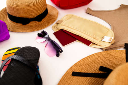 Hat, sunglasses and swimwear. Beach accessories. Luggage, travel items, suitcase and hat. Preparing for vacation or travel.の写真素材