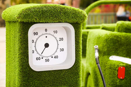 Green grass car and gas station. Environmental protection, maintaining clean air, refueling cars with biofuel, environmentally friendly.の写真素材