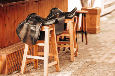 Bar counter, chairs in the form of horse saddlesの写真素材