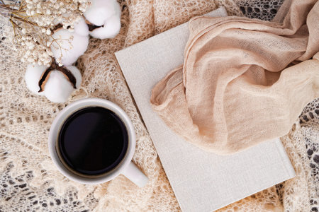 Cozy winter or autumn still life details, feminine white table with sketch book, coffee, dried...