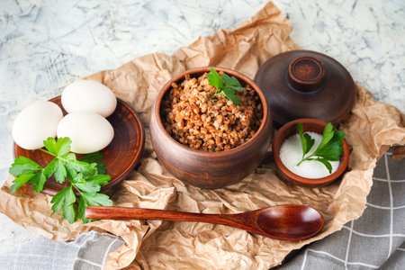 Protein rich food, healthy breakfast, healthy food concept, diet. Buckwheat porridge in a pot, boiled eggs.の写真素材