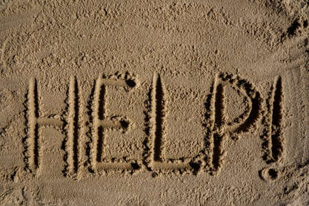 Help me the inscription on the sand. Please help me. On a tropical beach.の写真素材
