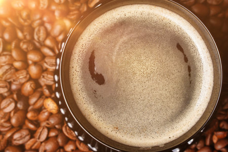 Top view of hot coffee cappuccino cup with foam, sunlight good morning