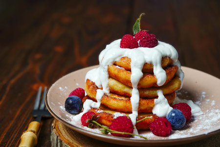 Good morning, sweet healthy breakfast cottage cheese pancakes, Syrniki with fresh mint. Pancakes...