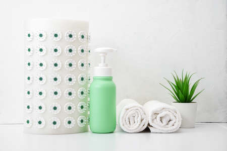 Acupuncture massage pillow with green white micro needles and magnets to improve blood circulation, medical device. Kuznetsov applicator close-up, alternative medicineの写真素材