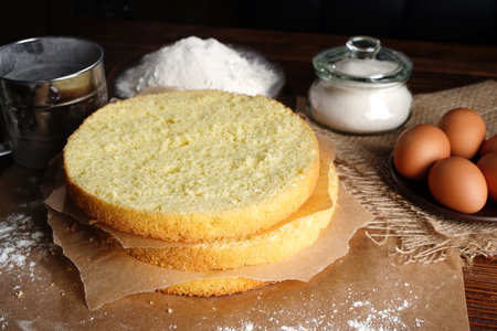 Sponge Cake Layers, Sponge cake, shortcakes on baking grid, text space, selective focus, close up.