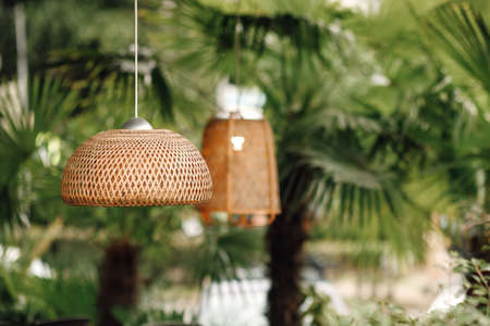 Wicker lampshade in an outdoor street cafe. Vintage decorativeの写真素材