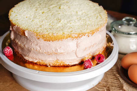 Homemade naked layered vanilla cake with whipped cream and fresh berries. Summer cake. Copy spaceの写真素材