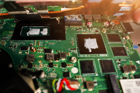 Thermal paste compound squeezing on processor of notebook. Thermal grease for better cooling of...