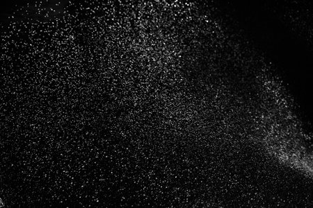 White dust or water drops on black backgroundの写真素材
