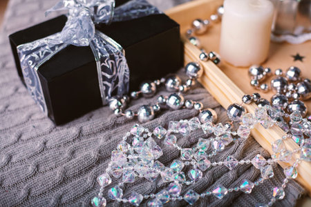 Beautiful Christmas interior with decor. Cozy evening with Christmas tree, lights and coffee.の写真素材