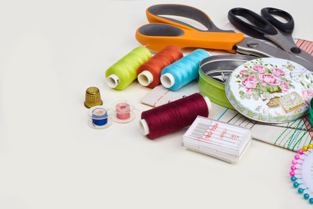 Set of objects for needlework on white background. The composition of elements for sewing
