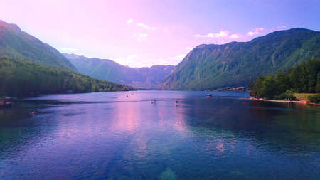 Lake bohinj in slovenia surrounded with mountainsの写真素材