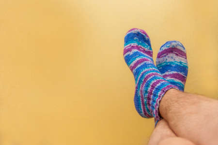 Colorful socks on a yellow backgroundの写真素材