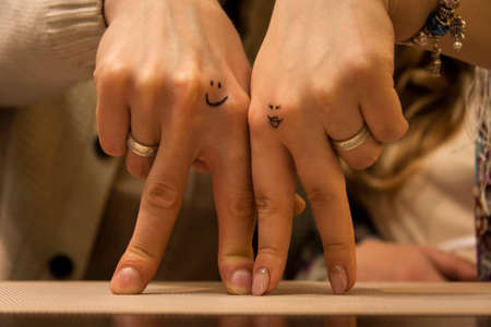 Two hands of lovers cringe at their weddingの写真素材