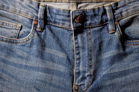 Blue jeans texture with button and zip details