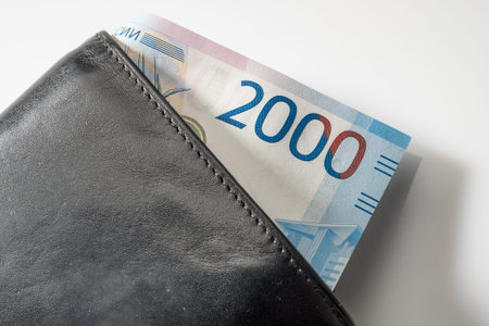Black natural leather wallet isolated on white background. Expensive man's purse closeup. New...