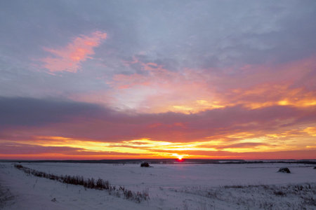 Majestic sunset in the winter landscape. Fantastic morning landscape glowing by sunlight. Dramatic wintry scene. Natural park.の写真素材