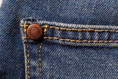 Close up back blue Jeans denim pocket texture.