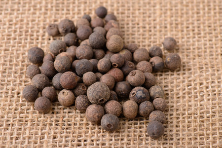 allspice on burlap closeup macroの写真素材