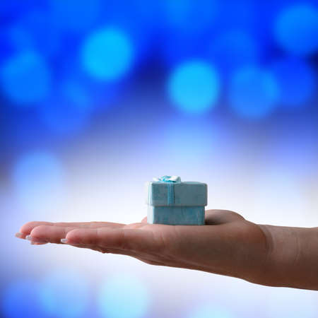 Christmas gift on a blue backgroundの写真素材