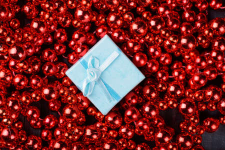 white gift in red garland on Christmas and New Yearの写真素材