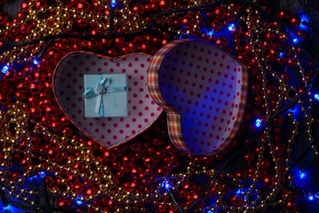 gift heart in red beads on holidayの写真素材