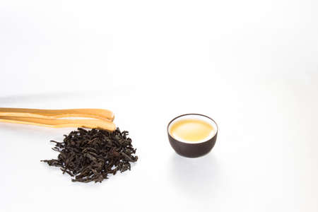 tea and the Chinese cup with tea on a white backgroundの写真素材