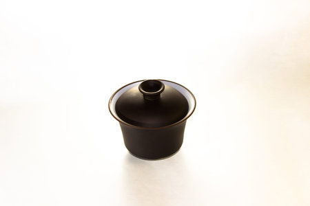 The Chinese ceramic gaiwan for holding a tea ceremony on a white background.の写真素材