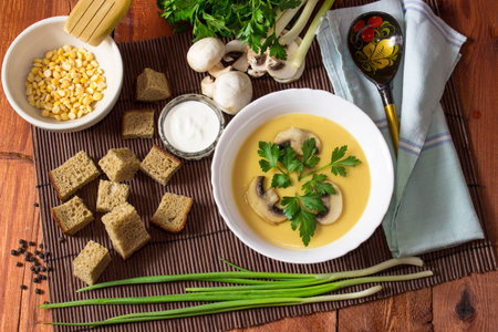 Cream pea soup with mushrooms, greens and breadcrumbsの写真素材
