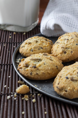 cereal cookies with milk on a wooden background