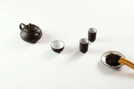 small clay teapot, tea and tea ceremony supplies on a white background è¶ç¯の写真素材