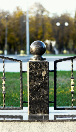 marble column with a marble ball at the top, a fragment of the fenceの写真素材