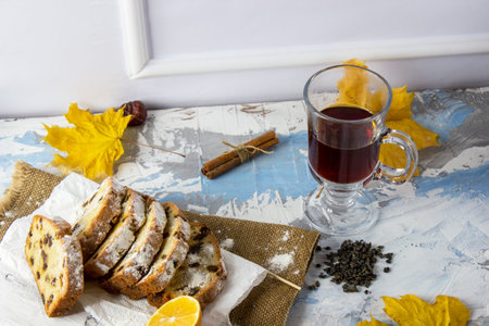 Slices of homemade raisin cake with black tea. Raisin bread cake. Breakfast concept. Rustic style....