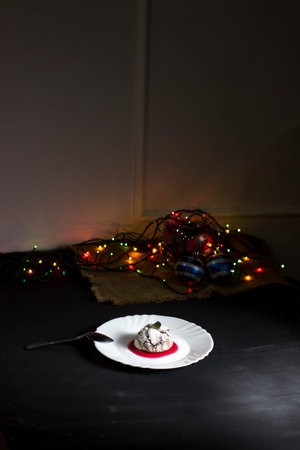 chocolate muffin on a dark background in a low key. Christmas evening.