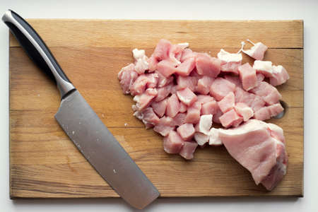 Slices of pork on a cutting boardの写真素材
