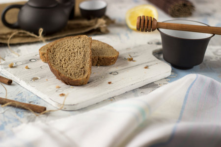 Pieces of bread with butter and honey